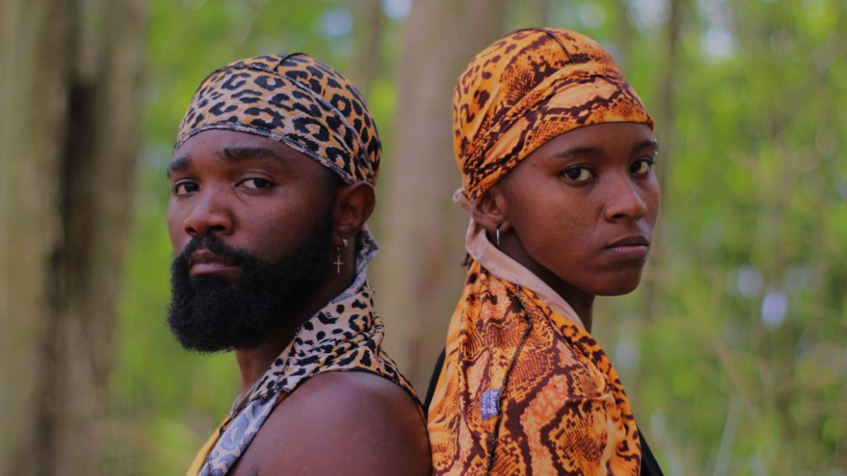 Arte de linha preto e branco do homem usando distintivo durag