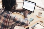 depositphotos_175088276-stock-photo-african-american-man-using-laptop